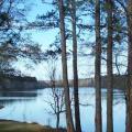  A view of a watershed dam from the bank looking across the lake.