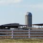 Farm grain silo and barn.
